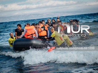 Volunteer lifeguards bring a stranded boat safely to the Greek island of Lesbos, on September 30, 2015.  (