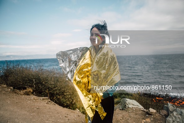 A child wrapped in a thermal blanket along the coast of Lesbos, Greece, on September 30, 2015.  