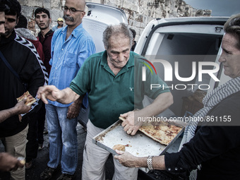 Hundreds of refugees continue to arrive on the Greek Island of Kos from Bodrum, Turkey, on October 21, 2015. Both the local community and la...