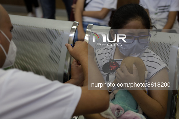 A child receives the first dose of Pfizer's during the pediatric vaccination campaign for children under 8 years of age   against Covid19 at...