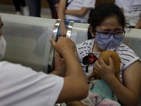 A child receives the first dose of Pfizer's during the pediatric vaccination campaign for children under 8 years of age   against Covid19 at...