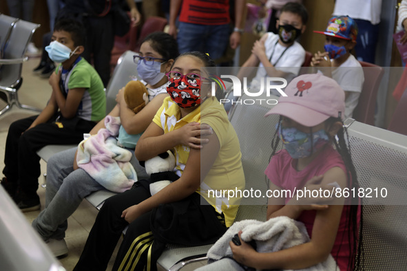 A child receives the first dose of Pfizer's during the pediatric vaccination campaign for children under 8 years of age   against Covid19 at...