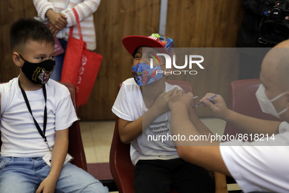 A child receives the first dose of Pfizer's during the pediatric vaccination campaign for children under 8 years of age   against Covid19 at...