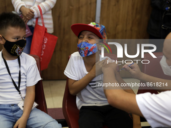 A child receives the first dose of Pfizer's during the pediatric vaccination campaign for children under 8 years of age   against Covid19 at...