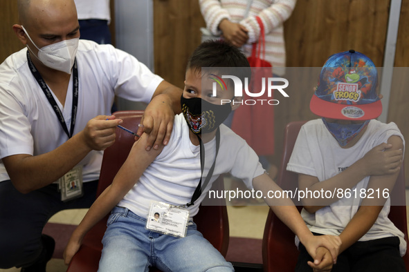 A child receives the first dose of Pfizer's during the pediatric vaccination campaign for children under 8 years of age   against Covid19 at...