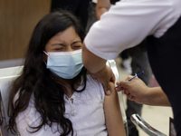 A child receives the first dose of Pfizer's during the pediatric vaccination campaign for children under 8 years of age   against Covid19 at...