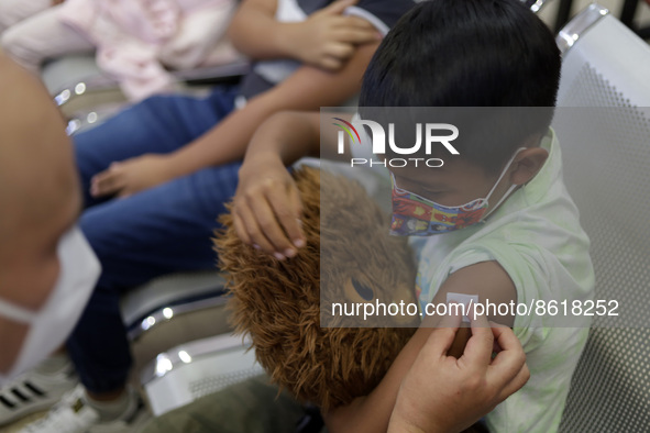 A child receives the first dose of Pfizer's during the pediatric vaccination campaign for children under 8 years of age   against Covid19 at...