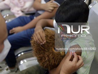 A child receives the first dose of Pfizer's during the pediatric vaccination campaign for children under 8 years of age   against Covid19 at...