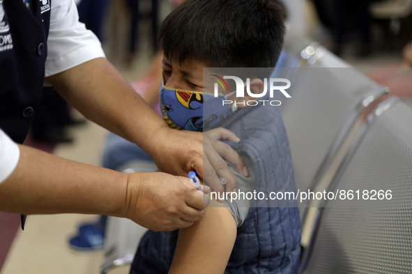 A child receives the first dose of Pfizer's during the pediatric vaccination campaign for children under 8 years of age   against Covid19 at...