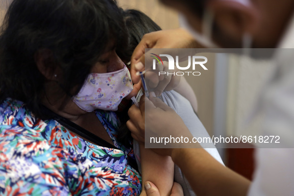 A child receives the first dose of Pfizer's during the pediatric vaccination campaign for children under 8 years of age   against Covid19 at...