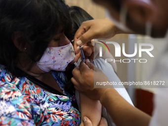 A child receives the first dose of Pfizer's during the pediatric vaccination campaign for children under 8 years of age   against Covid19 at...