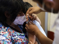 A child receives the first dose of Pfizer's during the pediatric vaccination campaign for children under 8 years of age   against Covid19 at...