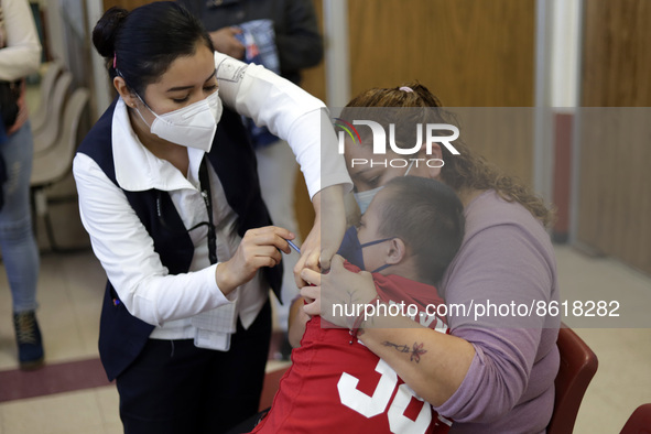 A child receives the first dose of Pfizer's during the pediatric vaccination campaign for children under 8 years of age   against Covid19 at...