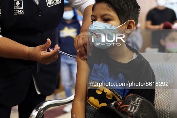 A child receives the first dose of Pfizer's during the pediatric vaccination campaign for children under 8 years of age   against Covid19 at...