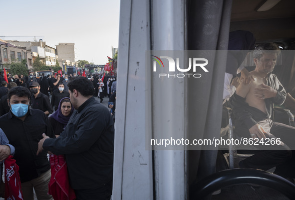 An Iranian man receives a dose of the Iranian Noora new coronavirus disease (COVID-19) vaccine at a mobile vaccination station during a cere...