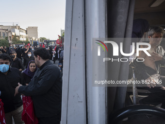 An Iranian man receives a dose of the Iranian Noora new coronavirus disease (COVID-19) vaccine at a mobile vaccination station during a cere...