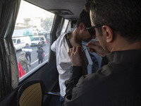 An Iranian man receives a dose of the Iranian Noora new coronavirus disease (COVID-19) vaccine at a mobile vaccination station during a cere...