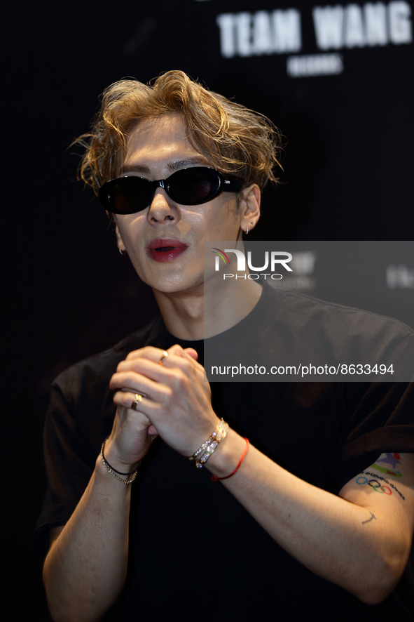 Chinese singer, record producer, fashion designer and music video director, Jackson Wang gestures to his waiting fans ahead of his showcase...