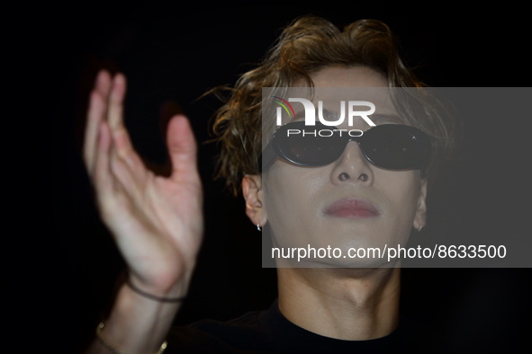 Chinese singer, record producer, fashion designer and music video director, Jackson Wang gestures to his waiting fans ahead of his showcase...