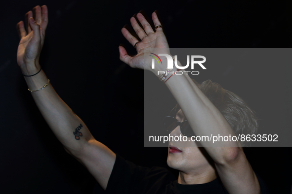 Chinese singer, record producer, fashion designer and music video director, Jackson Wang gestures to his waiting fans ahead of his showcase...