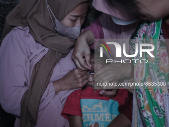 
A crying baby is immunized by a medical officer, during the BIAS (National Child Immunization Month) program at  Integrated Healthcare Cen...