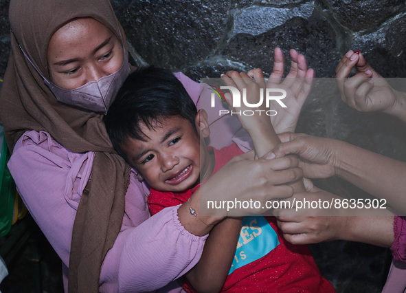 
A crying baby is immunized by a medical officer, during the BIAS (National Child Immunization Month) program at  Integrated Healthcare Cen...