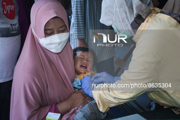 
A crying baby is immunized by a medical officer, during the BIAS (National Child Immunization Month) program at  Integrated Healthcare Cen...