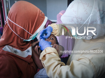 
A crying baby is immunized by a medical officer, during the BIAS (National Child Immunization Month) program at  Integrated Healthcare Cen...