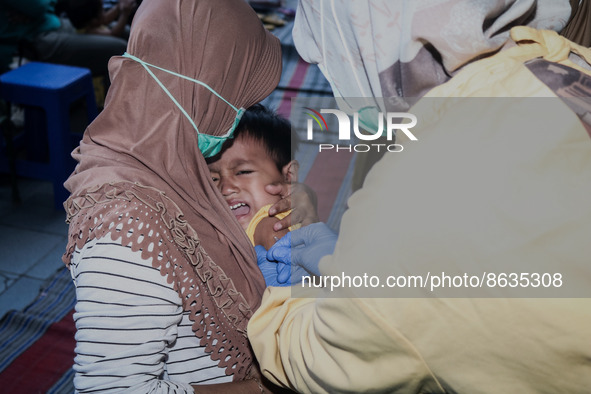 
A crying baby is immunized by a medical officer, during the BIAS (National Child Immunization Month) program at  Integrated Healthcare Cen...