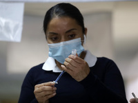 August 8, 2022, Mexico City, Mexico: A Health personnel prepares the CanSino Covid19 vaccine for adults in the first dose or booster dose at...