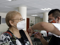 August 8, 2022, Mexico City, Mexico: Health personnel apply the CanSino Covid19 vaccine for adults in the first dose or booster dose at the...