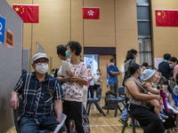 People waiting in line to get a jab of the Sinova CoronaVac vaccine made by Sinovac Biotech Ltd. a Chinese biopharmaceutical company at a Va...