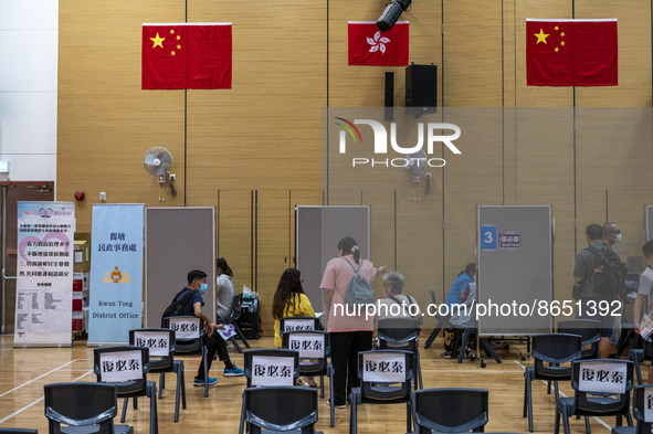 People waiting in line to get a jab of the Covid-19 Vaccine at a Vaccination Center on August 11, 2022 in Hong Kong, China. Hong Kong has re...