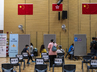 People waiting in line to get a jab of the Covid-19 Vaccine at a Vaccination Center on August 11, 2022 in Hong Kong, China. Hong Kong has re...