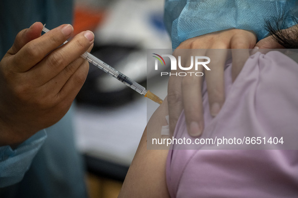 People waiting in line to get a jab of the Sinova CoronaVac vaccine made by Sinovac Biotech Ltd. a Chinese biopharmaceutical company at a Va...