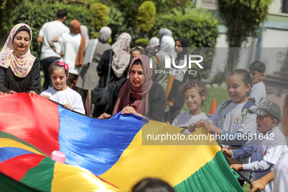 Palestinians participate in a fun day as part of community mental health programs after the latest conflict between Israel and Palestinian m...