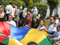 Palestinians participate in a fun day as part of community mental health programs after the latest conflict between Israel and Palestinian m...