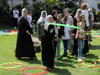 Palestinians participate in a fun day as part of community mental health programs after the latest conflict between Israel and Palestinian m...