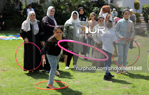 Palestinians participate in a fun day as part of community mental health programs after the latest conflict between Israel and Palestinian m...