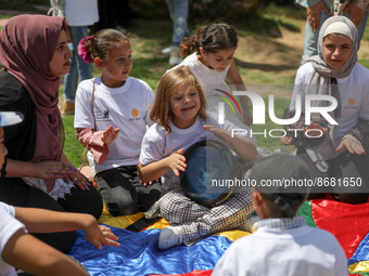 Palestinians participate in a fun day as part of community mental health programs after the latest conflict between Israel and Palestinian m...