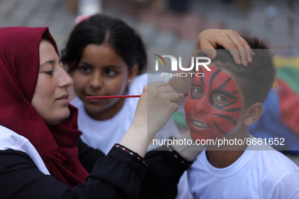 Palestinians participate in a fun day as part of community mental health programs after the latest conflict between Israel and Palestinian m...