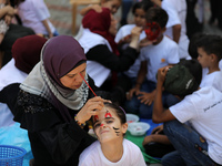 Palestinians participate in a fun day as part of community mental health programs after the latest conflict between Israel and Palestinian m...