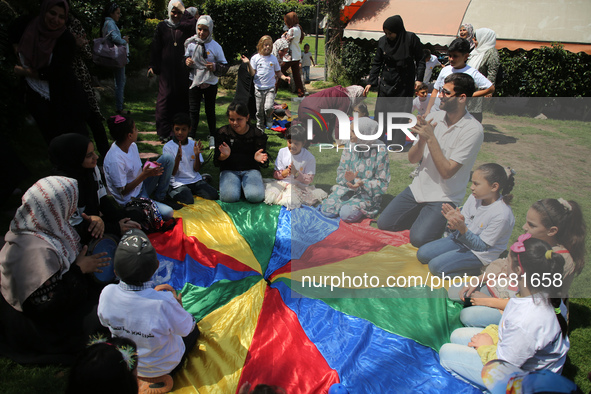 Palestinians participate in a fun day as part of community mental health programs after the latest conflict between Israel and Palestinian m...