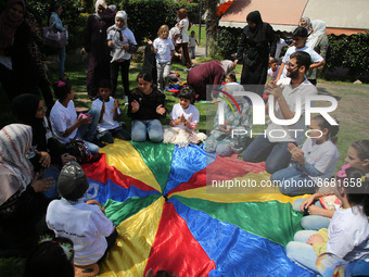 Palestinians participate in a fun day as part of community mental health programs after the latest conflict between Israel and Palestinian m...