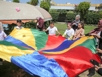 Palestinians participate in a fun day as part of community mental health programs after the latest conflict between Israel and Palestinian m...