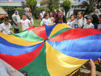 Palestinians participate in a fun day as part of community mental health programs after the latest conflict between Israel and Palestinian m...