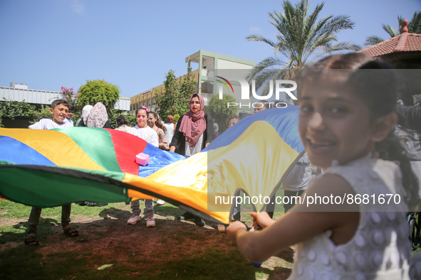 Palestinians participate in a fun day as part of community mental health programs after the latest conflict between Israel and Palestinian m...