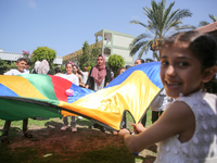 Palestinians participate in a fun day as part of community mental health programs after the latest conflict between Israel and Palestinian m...