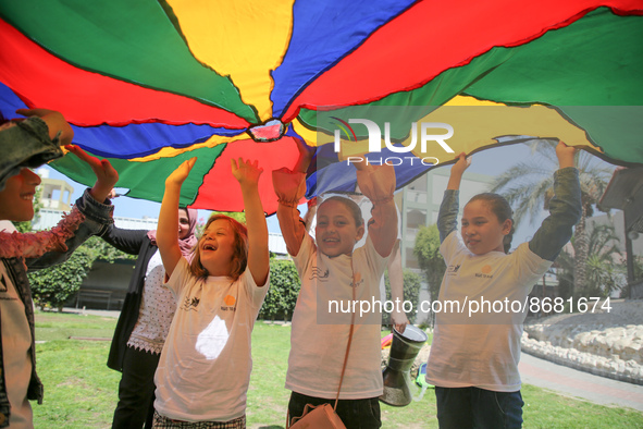 Palestinians participate in a fun day as part of community mental health programs after the latest conflict between Israel and Palestinian m...