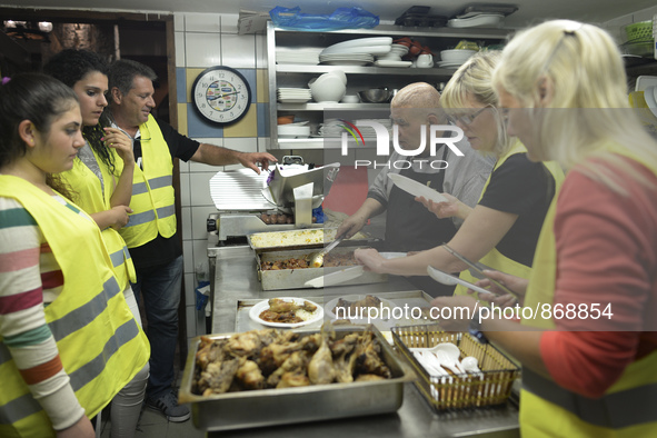 Michael Pastrikos (third from the left), the Aspa Boomerang Restaurant owner, helped by his family members, his staff and many international...